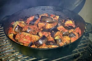 photo of Spiced aubergine and tomatoes in a skillet