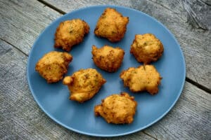 phot of eight Hush Puppies on a grey plate