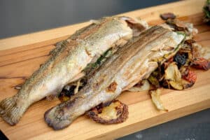 photo of Grilled trout on a board