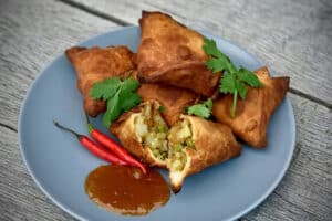 photo of several Vegetable Samosas on a plate