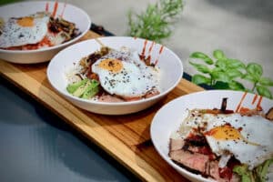 Photo of Bibimbap - Korean Rice Bowl on slather board