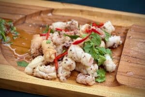 photo of Szechuan Pepper Squid on a slater board