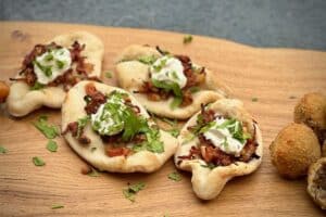 photo of four Turkish Pizza on a board