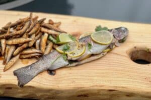 photo of Rainbow Trout en Papillote on a board
