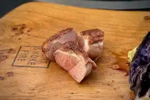 photo of blushing Pan fried duck breast on a board