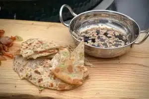 photo of Spring Onion Pancakes on a board with a dipping sauce