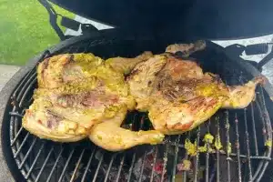 photo of a whole Thai Grilled Chicken - Gai Yang on a bbq grill