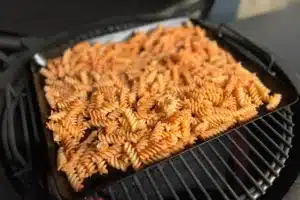 photo of Pasta Fries on a baking tray on a bbq grill