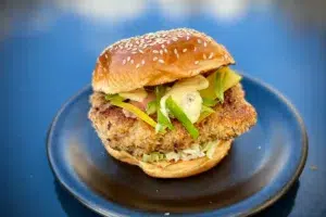 photo of Crispy Japanese Chicken Burger on a black plate