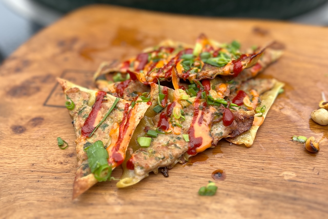 photo of Thai Pork Dumpling Nachos on a board