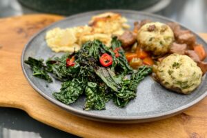 photo of Cavalo Nero plated with casserole on a plate