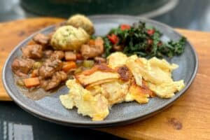 photo of Celariac and turnip dauphinoise on a plate as part of a dinner