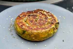 picture of Crispy spinach and feta spirals on a grey plate