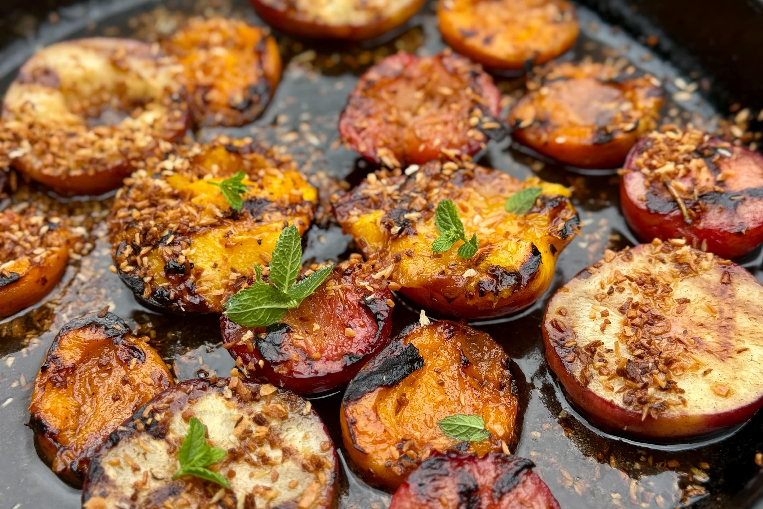 Grilled friut with spiced rum butter sauce