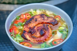 Thai Broth with pork belly pinwheel
