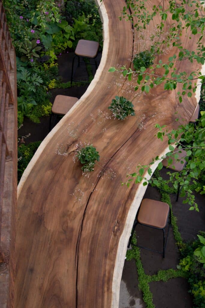 Photo of a 20 person dining table, cut from a tree, displayed at the Chelsea Flower Show
