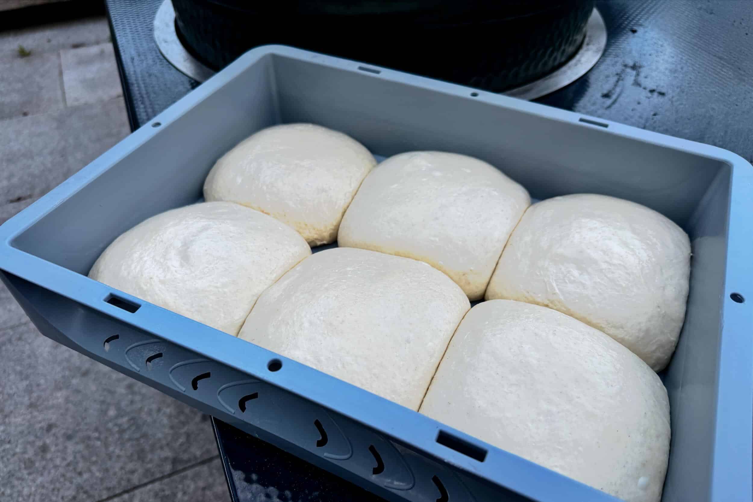 A photo of Pizza Dough next to the Big Green Egg