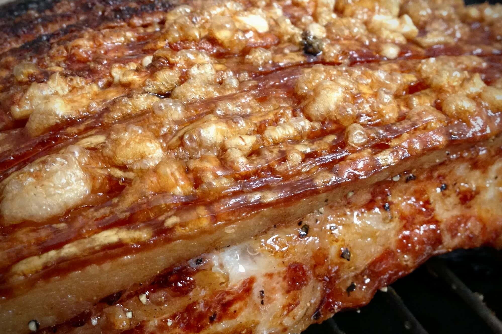a photo of Slow Roasted Pork Belly cooked on the Big Green Egg using the method at meatsmokefire.co.uk